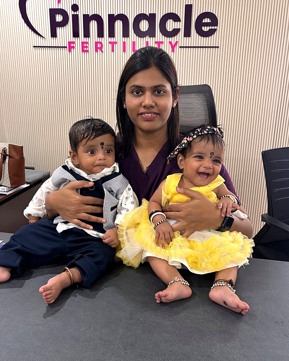 Dr. Archana with twin babies born to a Pinnacle Fertility family